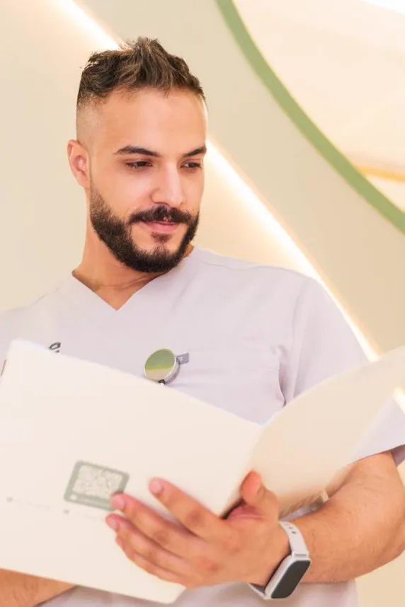 A Longevium doctor reviewing test results and documents